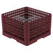A burgundy plastic Vollrath Traex Plate Crate with metal grates.