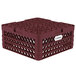 A burgundy plastic Vollrath Traex plate rack with holes.