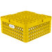 A yellow plastic Vollrath Traex Plate Crate with handles and 20 compartments.