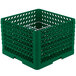 A green plastic Vollrath Traex Plate Crate with compartments and holes.