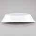 A white Tablecraft melamine bowl on a gray background.