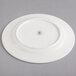 A white Homer Laughlin Kensington Ameriwhite china plate.