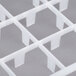 A close-up of a white plastic grid with 18 compartments.