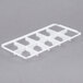 A white plastic Vollrath trim divider for a glass rack with 10 compartments.