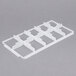 A white plastic Vollrath glass rack trim divider with ten compartments.
