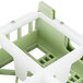 A green plastic Vollrath glass rack trim divider with four compartments.