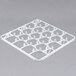 A white plastic grid with holes for Vollrath full-size glass racks.