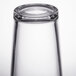 A close up of a Libbey tall mixing glass with a white background.