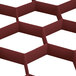 A red plastic Vollrath TRJ-21 Traex glass rack extender with white hexagons.
