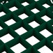 A green plastic grid extender with squares.