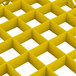 A yellow plastic grid extender with square holes.