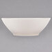 A Homer Laughlin ivory china cereal bowl on a white surface