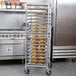 A Regency sheet pan rack holding trays of croissants.
