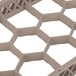 A beige plastic grid with hexagonal holes.