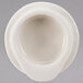 A white bowl with a Homer Laughlin Seville Ivory beverage server lid on top.