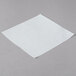 A white square patty paper.