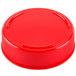A close-up of a red plastic bottle cap.