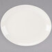 A Homer Laughlin ivory china platter with a rim on a gray surface.