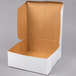 A white box with a brown lid.