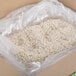 A plastic bag of Gulf Pacific Arborio Rice in a box.