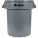 A gray plastic Continental Huskee trash can with a logo.