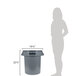 A woman standing next to a Continental grey round trash can.