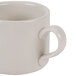 A close-up of a CAC Ivory China coffee mug with a handle.