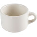 A white china cup with a handle.