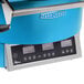 A blue and silver TurboChef Fire countertop pizza oven with digital controls.