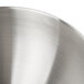 A close up of a silver KitchenAid mixing bowl.