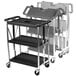 A black and silver Carlisle utility cart with three shelves.
