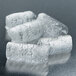 A group of ice cubes in a Follett 12CI425A-SI countertop ice maker.