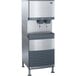 A stainless steel Follett 110 FB Series freestanding combination ice maker and water dispenser.