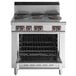 A stainless steel Garland electric restaurant range with six sealed burners and a standard oven.