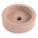 A round sharpening stone with a hole in the center.