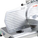 A close up of an Avantco meat slicer with a replacement regulator plate.