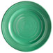 A close up of a Tuxton Concentrix cilantro green plate with a spiral pattern.