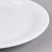 A Tuxton Colorado bright white china plate with a narrow white rim.