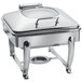 A silver metal Eastern Tabletop stainless steel chafer with a hinged glass lid on a stand.
