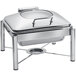 A silver rectangular stainless steel chafer with a hinged glass lid on a stand.