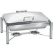 An Eastern Tabletop stainless steel rectangular chafer with stand and hinged dome cover on a table.