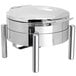 A stainless steel round chafer with a hinged dome lid on a pillar'd stand.