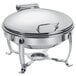 An Eastern Tabletop stainless steel chafer with a hinged dome lid on a stand.