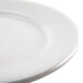 A close-up of a Homer Laughlin Pristine Ameriwhite bright white china plate with a white rim.