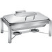 An Eastern Tabletop rectangular stainless steel chafer with a hinged glass dome lid on a stand.