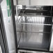 A Turbo Air stainless steel 2 door refrigerated sandwich prep table with a rack inside.