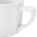 A close-up of a CAC Super White Clinton Frontier Mug with a handle.