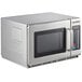 A Solwave stainless steel commercial microwave with a glass door.