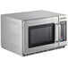 A silver Solwave commercial microwave with a glass door.
