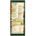 A green Menu Solutions K22-Kent menu board on a table in a farm-to-table restaurant.